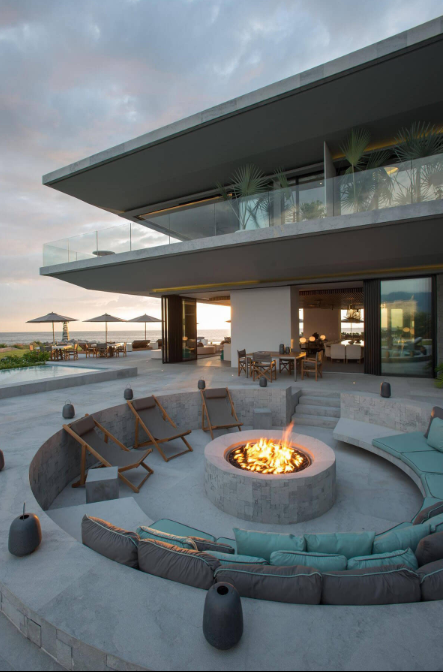 A Sunken Concrete Firepit with Comfortable Seating