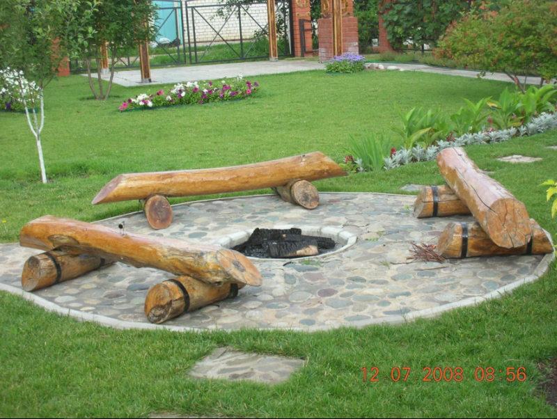 Log Benches Surrounding a Pit in Stone
